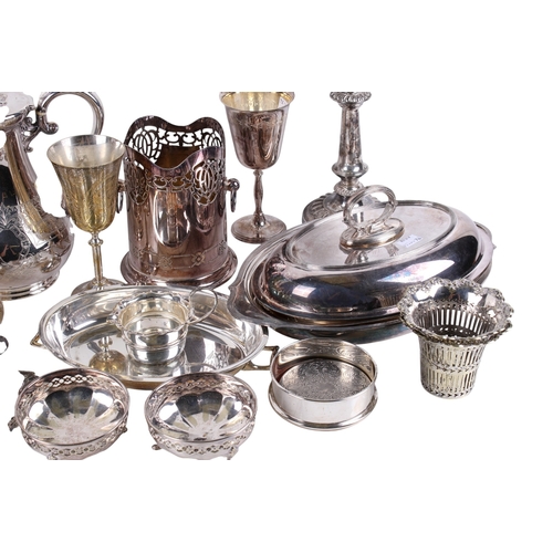 297 - A box of assorted silverplated table items. Including a coffee pot, candelabra, goblets, hair brush,... 