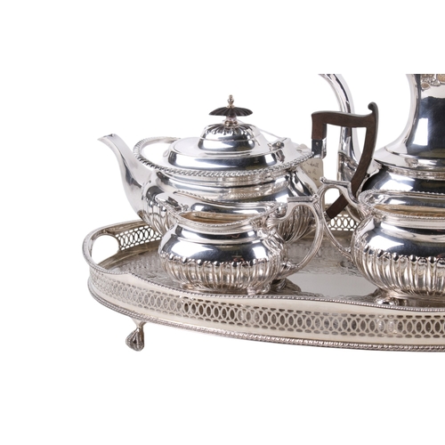 299 - A Walker and Hall silverplated teaset and tray. Comprising tea and coffee pot, milk jug and sugar bo... 