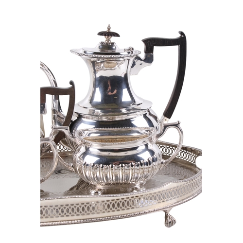 299 - A Walker and Hall silverplated teaset and tray. Comprising tea and coffee pot, milk jug and sugar bo... 