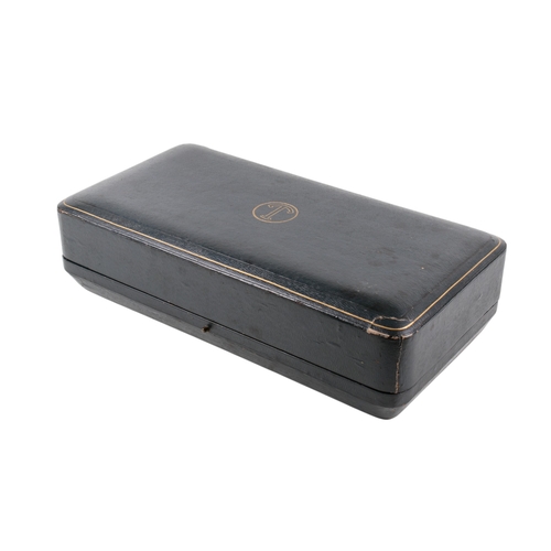 26 - An early 20th century matched silver tea set. The teapot, milk jug and sugar bowl decorated with rib... 