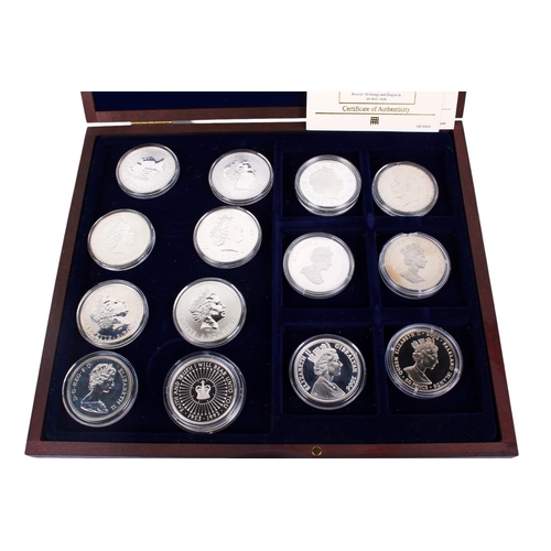 111 - A collection of fourteen assorted world crown size coins. Including six Britannia dated 1998-2001; 2... 