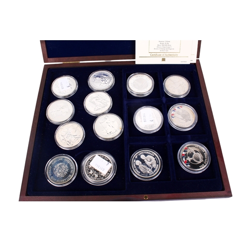 111 - A collection of fourteen assorted world crown size coins. Including six Britannia dated 1998-2001; 2... 
