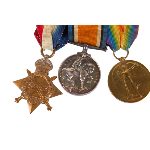 17 - A trio of WWI medals on ribbons in a Princess Mary Christmas 1914 gift tin. Comprising the 1914 Star... 