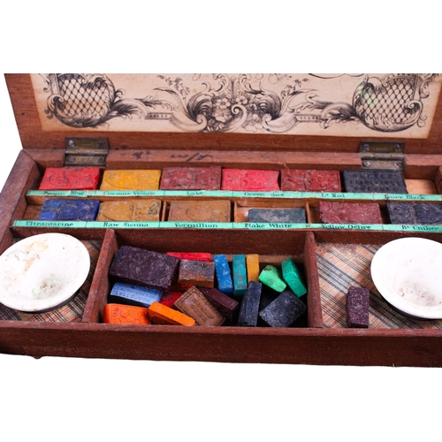 211 - An early 20th century 'London Made' mahogany artists box. The underside of the lid with paper label:... 