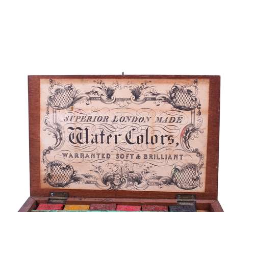 211 - An early 20th century 'London Made' mahogany artists box. The underside of the lid with paper label:... 