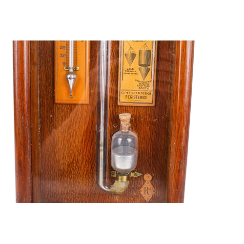 215A - A 19th century Royal Polytechnic 'Admiral Fitzroy' oak cased barometer by Joseph Davis & Co. The cas... 