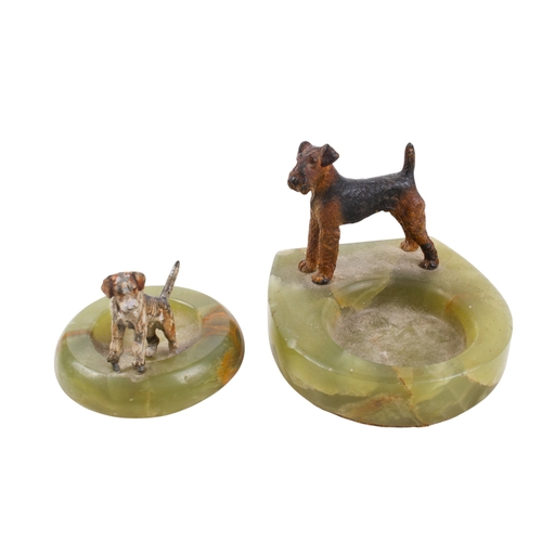 243 - Two 20th century onyx pin trays with painted cast metal dogs, in the style of Bergman. One of circul... 