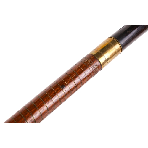 294 - Two sword sticks. The one having a stained mahogany hilt, brass mount and engraved blade, the wooden... 