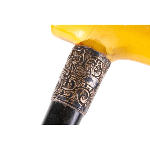 294A - Two white metal mounted and ebonized walking sticks and a similar swagger stick. The swagger stick h... 