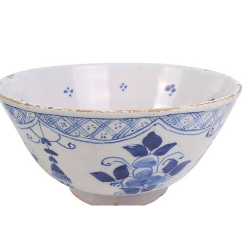 299 - Two mid-18th century blue and white English Delftware bowls. One decorated with bamboo, rocks and fl... 