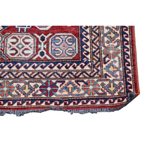 451 - A flat weave red, blue and cream rug. With zoomorphic patterns on a rust-red ground, 187cm x 133cm.