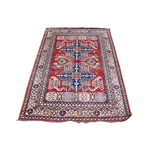 451 - A flat weave red, blue and cream rug. With zoomorphic patterns on a rust-red ground, 187cm x 133cm.