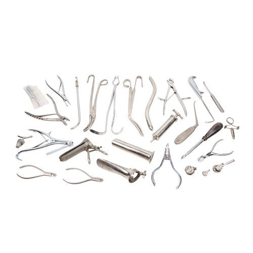 152 - A collection of medical and surgical tools. To include a syringe, a Trocar, and clamps with Broad Ar... 