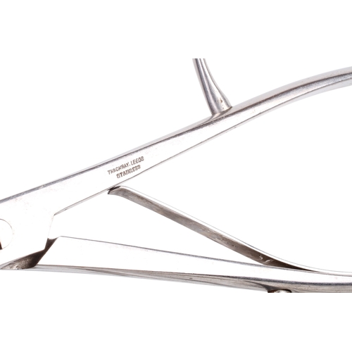 152 - A collection of medical and surgical tools. To include a syringe, a Trocar, and clamps with Broad Ar... 