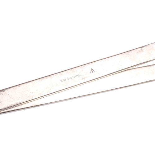 152 - A collection of medical and surgical tools. To include a syringe, a Trocar, and clamps with Broad Ar... 