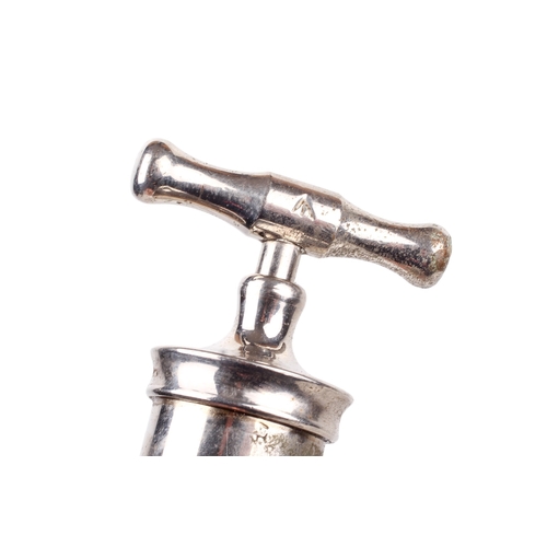 152 - A collection of medical and surgical tools. To include a syringe, a Trocar, and clamps with Broad Ar... 