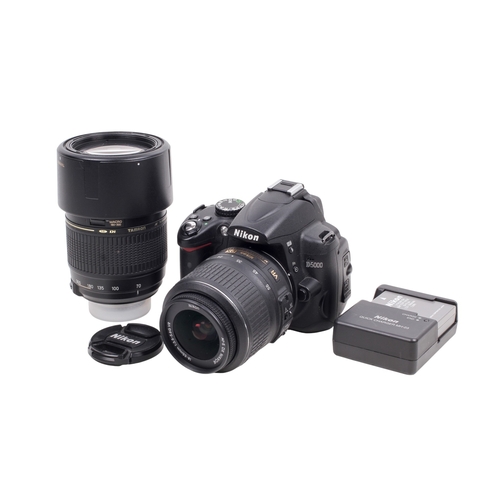 68 - A Nikon D5000 Digital SLR camera outfit. Powers on and shutter working. With two lenses; a Nikon 18-... 