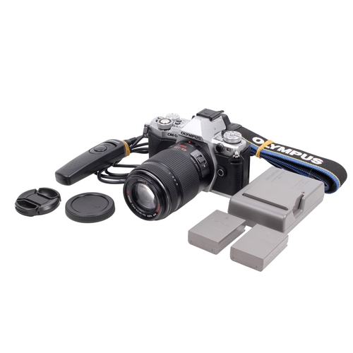 72 - An Olympus OM-D E-M5II Mirrorless Digital camera. Powers on, shutter working. With a Lumix G 45-175m... 