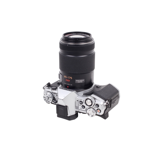 72 - An Olympus OM-D E-M5II Mirrorless Digital camera. Powers on, shutter working. With a Lumix G 45-175m... 