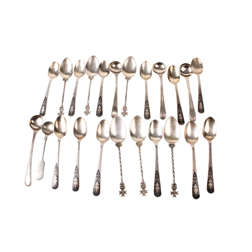 89 - An assortment of silver and white metal teaspoons. Including a set of twelve, the enamel handles dec... 