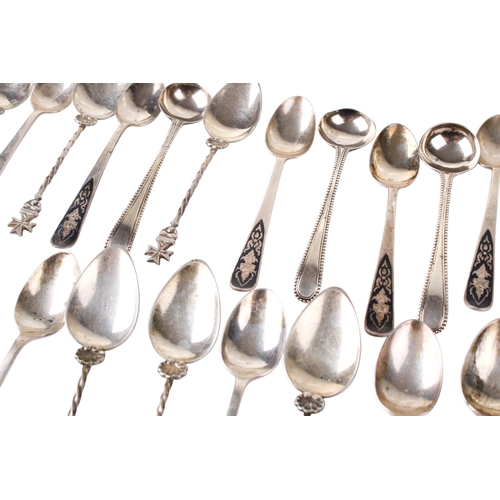 89 - An assortment of silver and white metal teaspoons. Including a set of twelve, the enamel handles dec... 