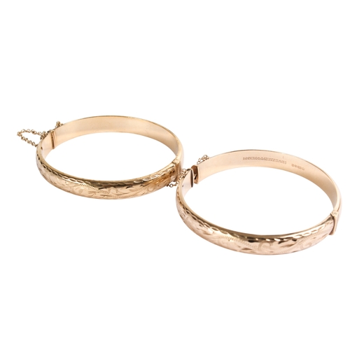197 - A 9ct gold bangle and a rolled gold example. With matching engraved design to one half, both with se... 