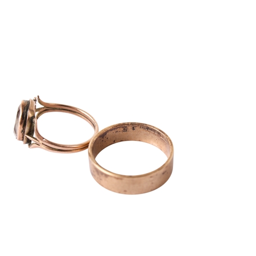 271 - A 9ct gold wedding band and a rose coloured metal and amethyst ring. The wedding band, size Q/R, wei... 