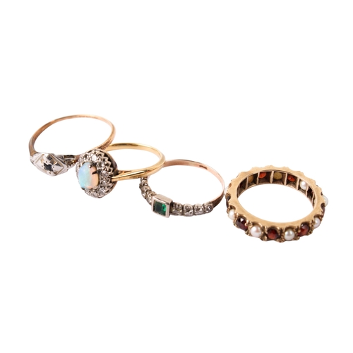 288 - Four yellow metal rings. Two marked 9ct, one set with tiny diamonds and an opal, one with garnets an... 