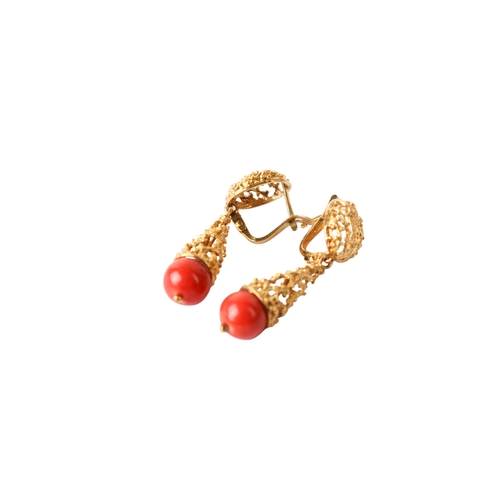 301 - A pair of drop earrings, each with a coral bead termination. Metal not marked, acid testing indicati... 
