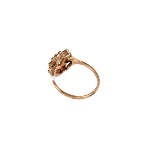 129 - A 9ct gold garnet cluster ring. Set with ten small stones around the central oval faceted stone, siz... 