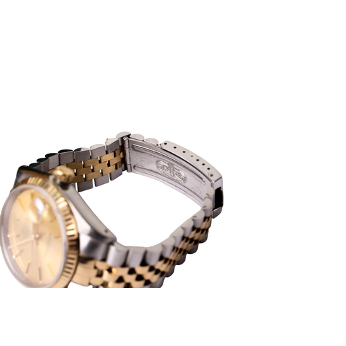 343 - A gentleman's Rolex Oyster Perpetual Day Date wristwatch. The champagne dial with baton hour markers... 