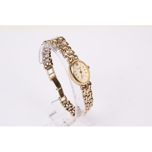 363 - A lady's 9ct gold Accurist wristwatch. The oval case having a champagne dial with baton hour markers... 