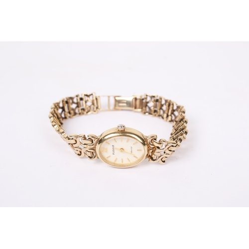 363 - A lady's 9ct gold Accurist wristwatch. The oval case having a champagne dial with baton hour markers... 