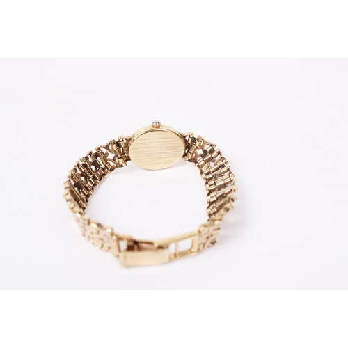 363 - A lady's 9ct gold Accurist wristwatch. The oval case having a champagne dial with baton hour markers... 