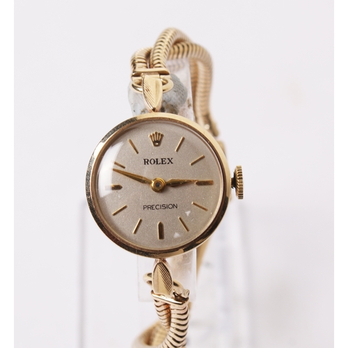 366 - A 1930s lady's 9ct gold Rolex Precision watch. The silvered dial having baton hour markers, in a 9ct... 