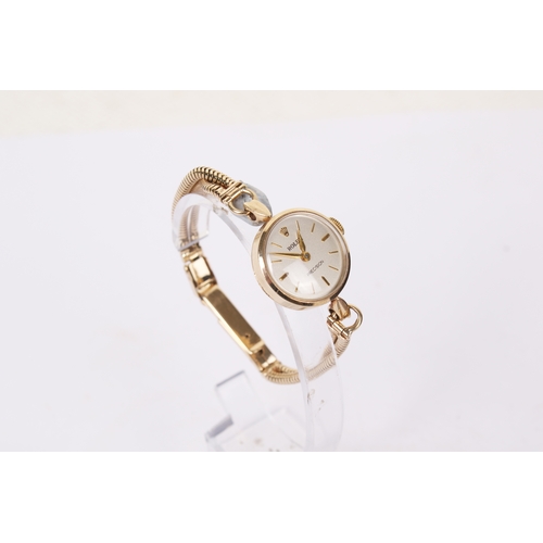 366 - A 1930s lady's 9ct gold Rolex Precision watch. The silvered dial having baton hour markers, in a 9ct... 