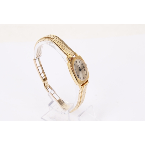 370 - A vintage 'Richard' gold lady's dress watch. The oval champagne face with black Roman numerals, mark... 