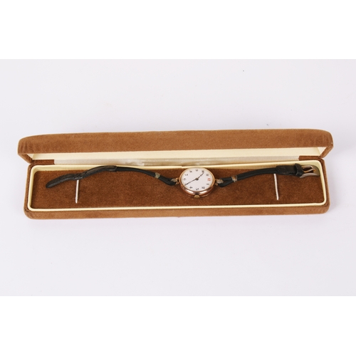 371 - A 9ct gold cased wristwatch. The white enamel face with black and red Arabic numerals, hallmarks to ... 