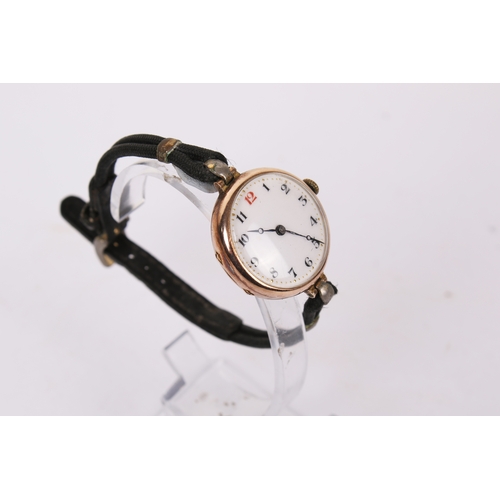371 - A 9ct gold cased wristwatch. The white enamel face with black and red Arabic numerals, hallmarks to ... 