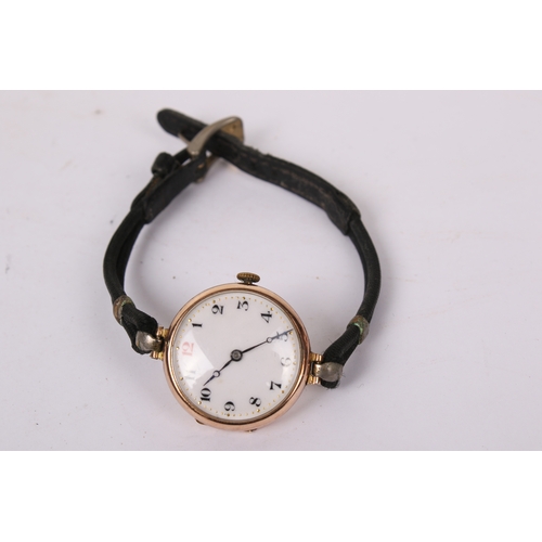 371 - A 9ct gold cased wristwatch. The white enamel face with black and red Arabic numerals, hallmarks to ... 