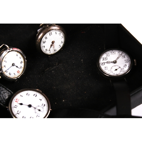 384 - Four silver cased watches. Comprising a pocket watch, the white enamel dial with Arabic numerals, di... 