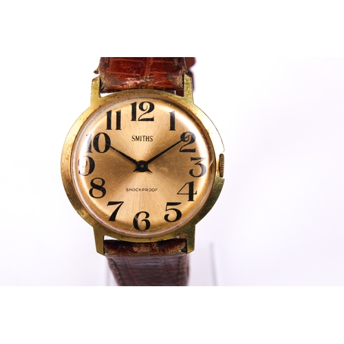 393 - A gentleman's vintage Smiths wristwatch. The gilt face having Arabic numerals, in a gold plated case... 