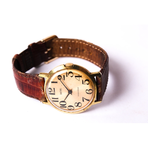 393 - A gentleman's vintage Smiths wristwatch. The gilt face having Arabic numerals, in a gold plated case... 