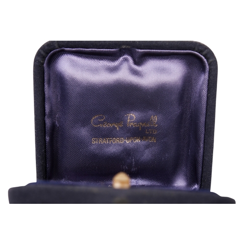 445 - A WWI 'Fumsup' lucky charm. Having a wooden head, white metal body and jointed arms, marked '636612'... 