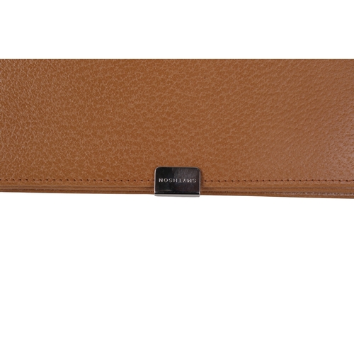472 - A Smythson of Bond Street tan leather purse. Having a crossgrain leather exterior and chrome sliding... 