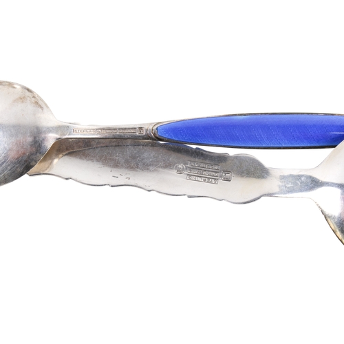 74 - Six pieces of Norweigan silver. Comprising a set of four dishes with enamel decoration featuring a V... 