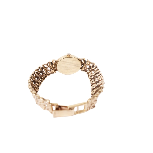 363 - A lady's 9ct gold Accurist wristwatch. The oval case having a champagne dial with baton hour markers... 