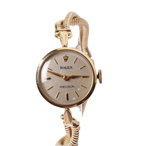 366 - A 1930s lady's 9ct gold Rolex Precision watch. The silvered dial having baton hour markers, in a 9ct... 