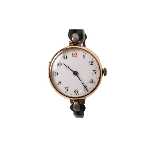 371 - A 9ct gold cased wristwatch. The white enamel face with black and red Arabic numerals, hallmarks to ... 