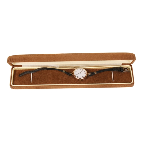 371 - A 9ct gold cased wristwatch. The white enamel face with black and red Arabic numerals, hallmarks to ... 